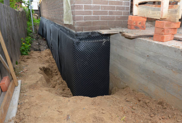 SJ Waterproofing Pros technician performing targeted Waterproofing assessment in Marysville, KS